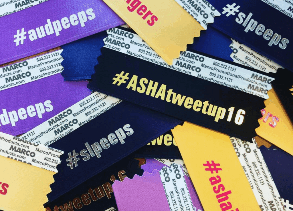 Pile of promotional ribbons displaying hashtags related to the ASHA community.