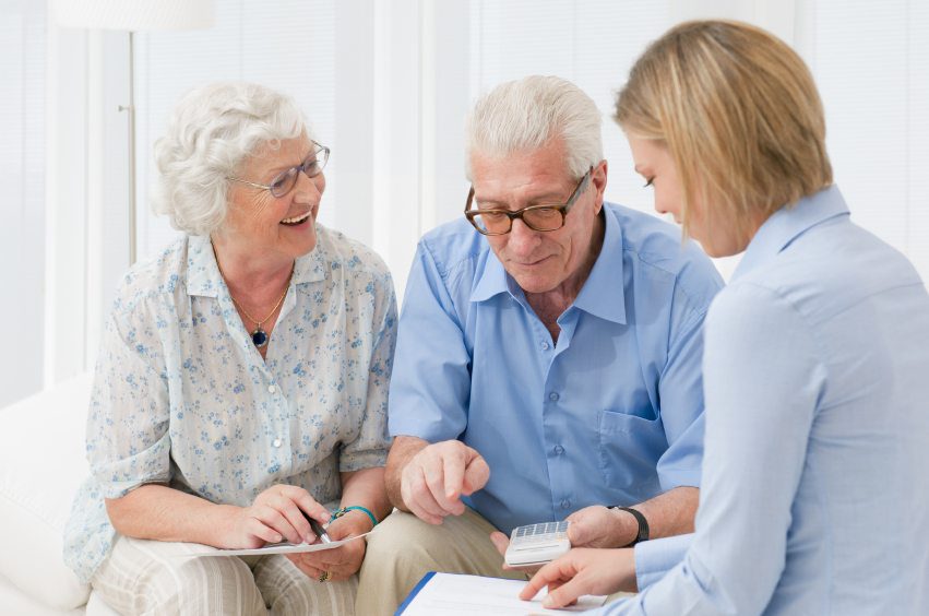 Elderly patients discussing therapy orders and insurance options with medical staff.
