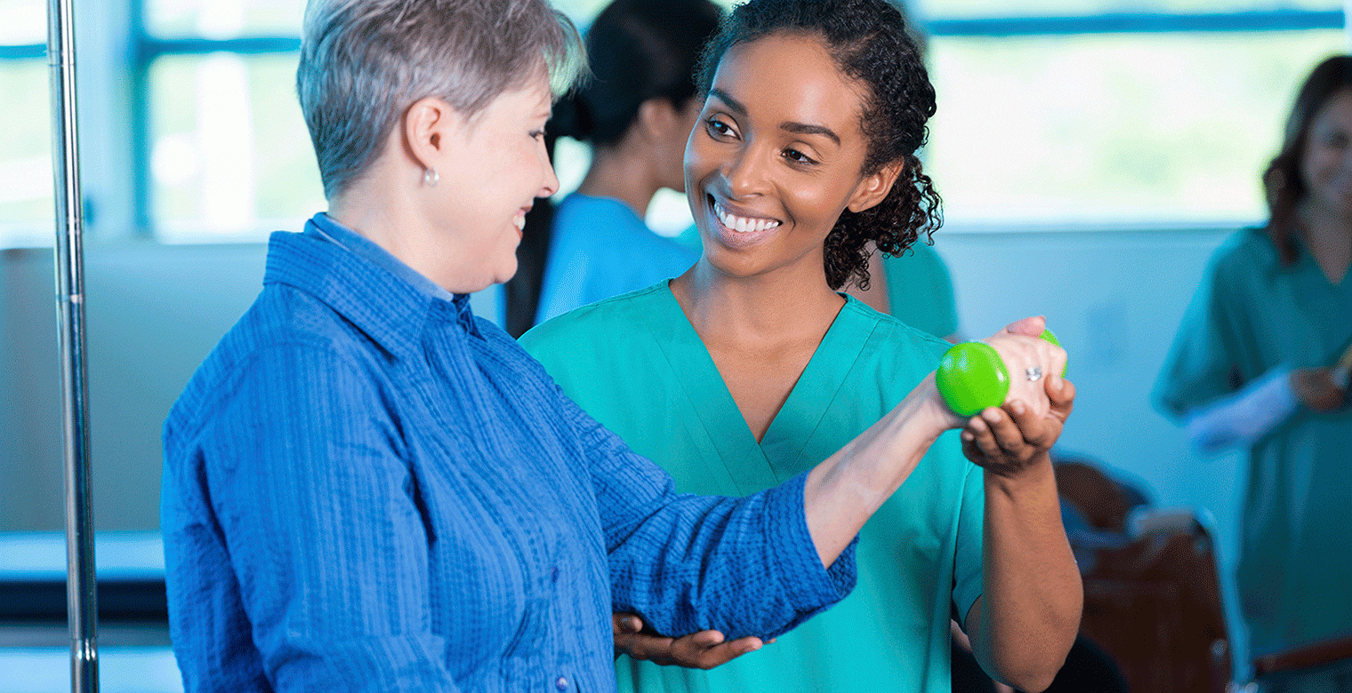 Healthcare professional supporting rehabilitation session, illustrating data-driven patient care